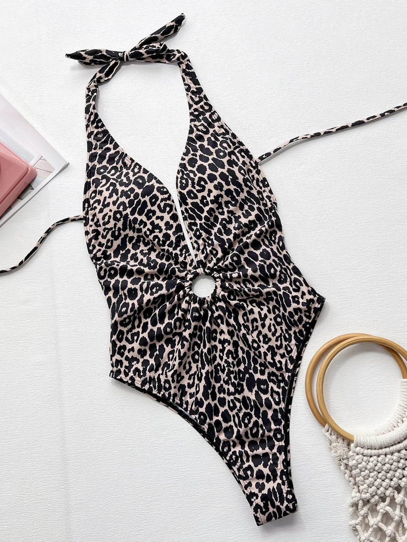 Leopard print women's one-piece swimsuit with a hollow-out ring design at the midriff.