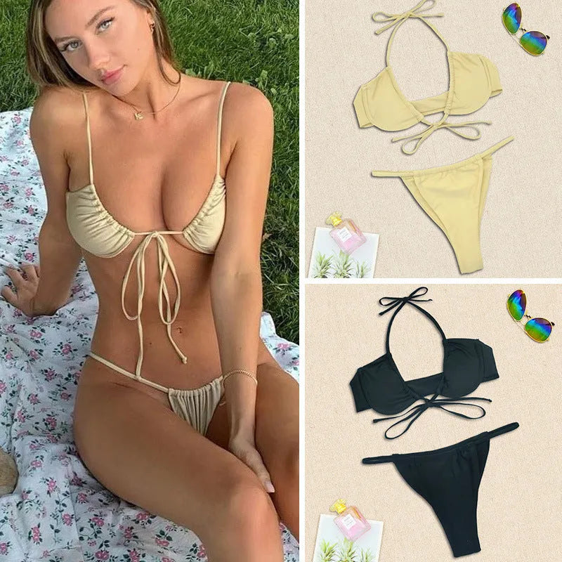 Women's black and mint green two-piece nylon bikini swimsuit laid flat