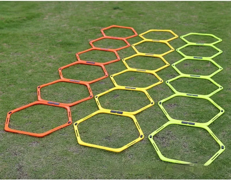 Set of six foldable hexagon football agility training rings in yellow, green, and orange colours