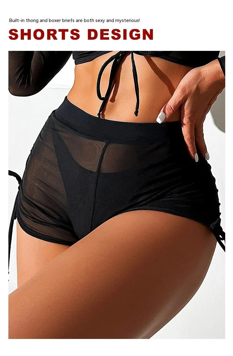 Black women's four-piece bikini swim set with long sleeves and mesh construction for swimming sports