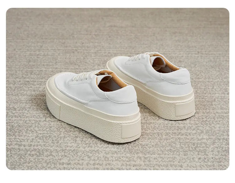 Women's black platform casual sports shoes with embossed cowhide upper and round toe design
