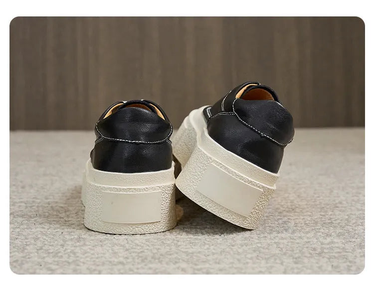 Women's black platform casual sports shoes with embossed cowhide upper and round toe design