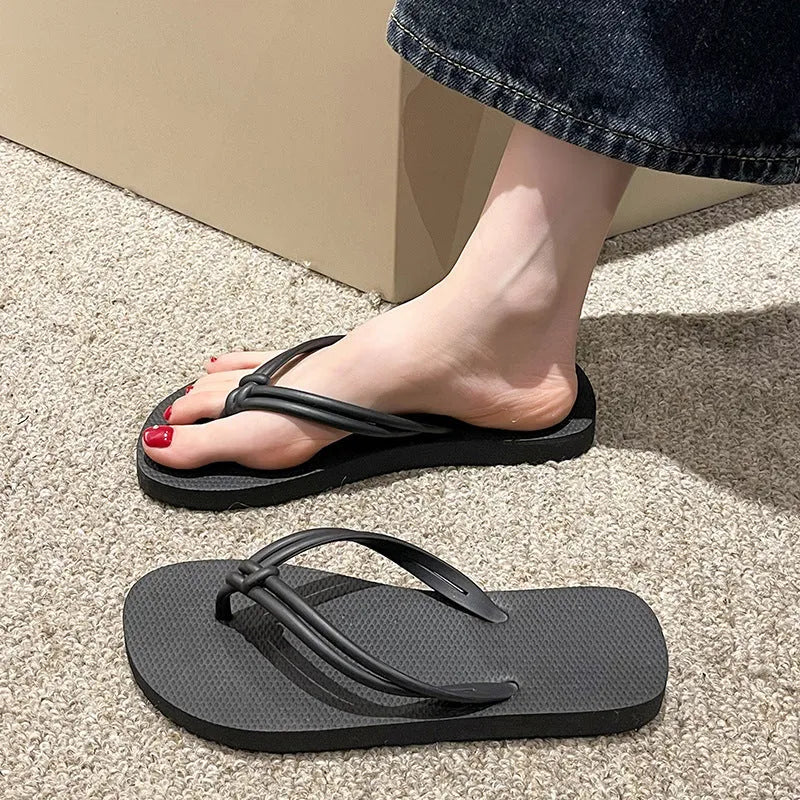 Men's PVC toe covering flip flops in beige on a plain background, showing non-slip sole.