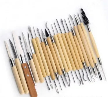27-piece pottery tool set with stainless steel, wood, and plastic tools organised in a brown roll package.