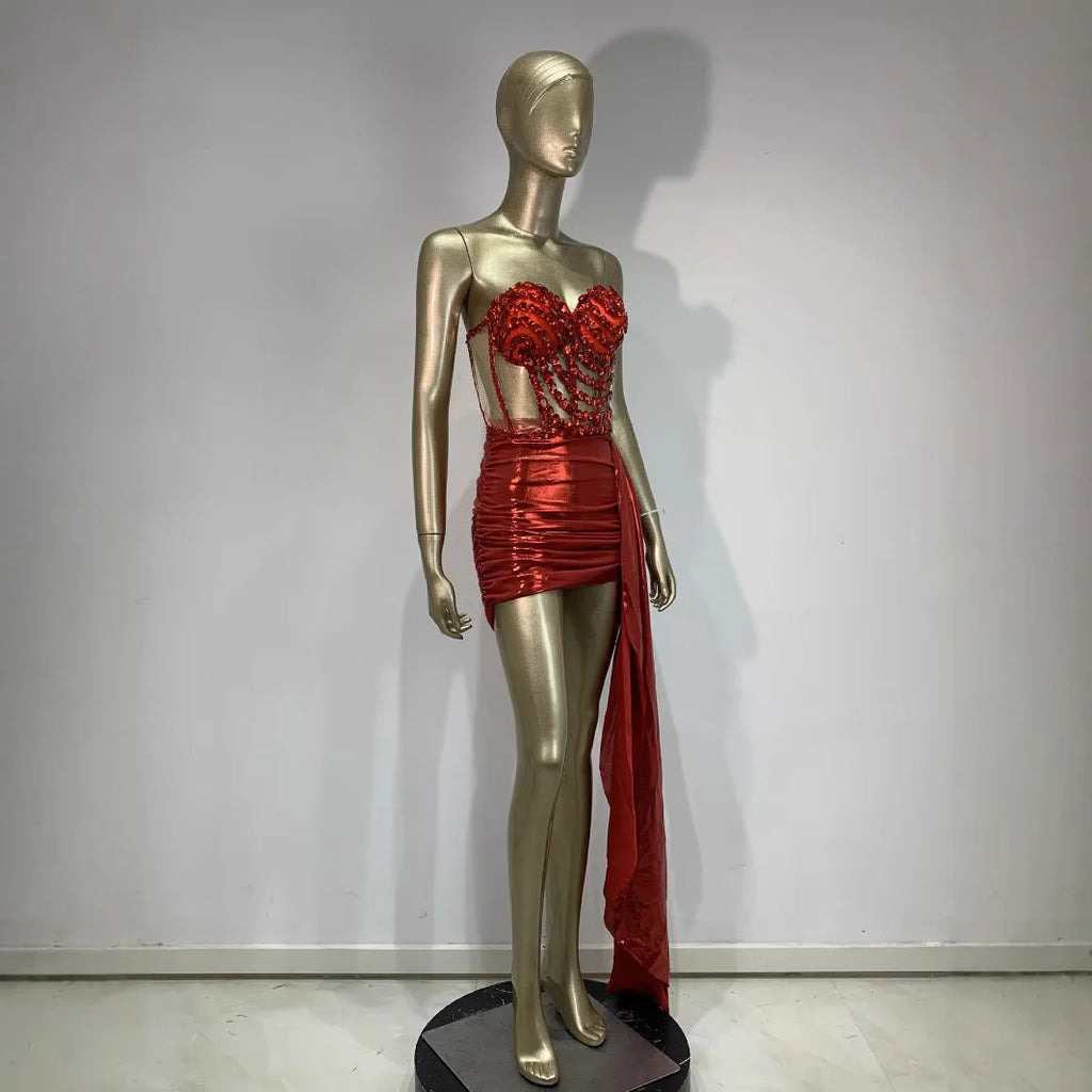 Red women's skirt suit with mesh see-through panels, a stage and party costume.