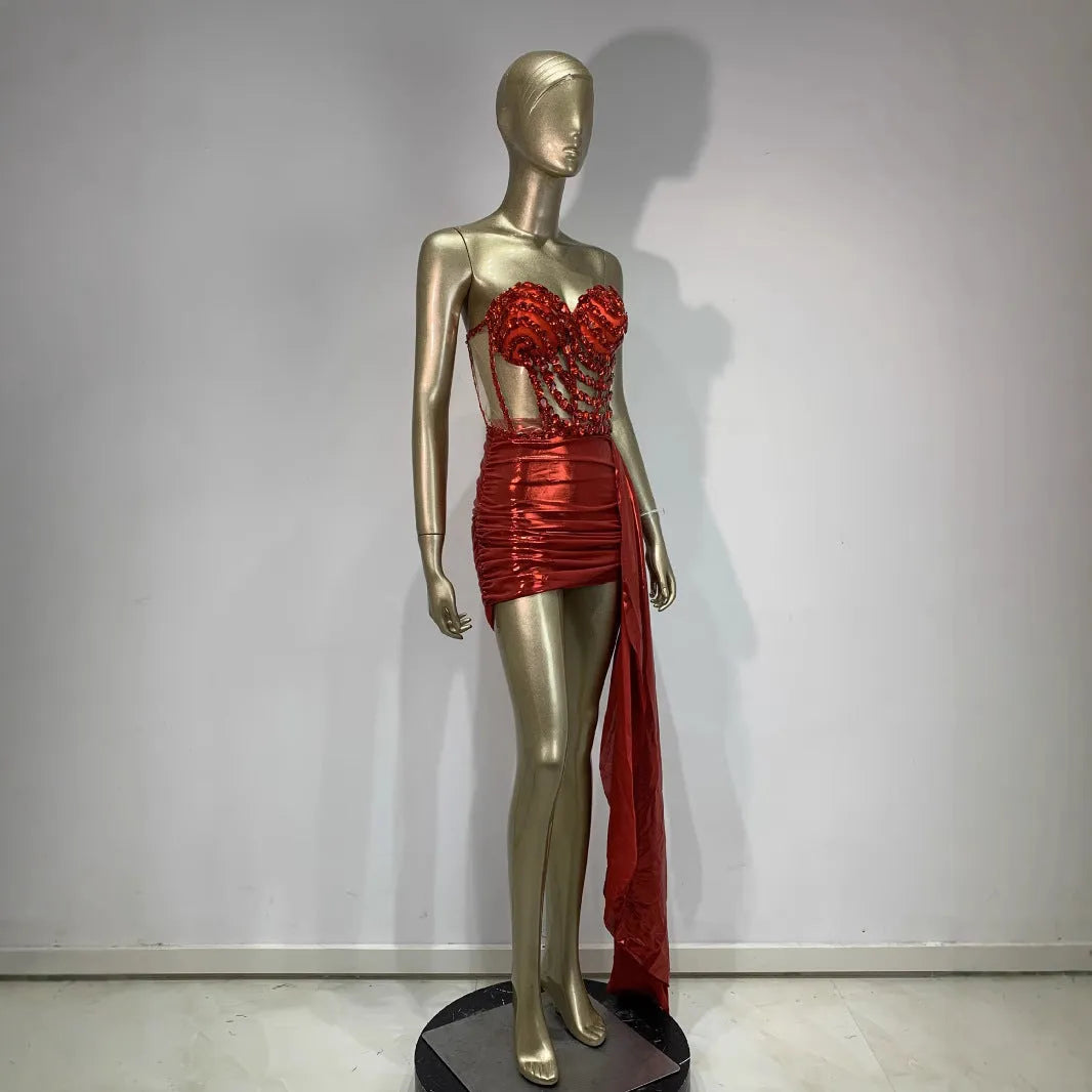 Red women's skirt suit with mesh see-through panels, a stage and party costume.