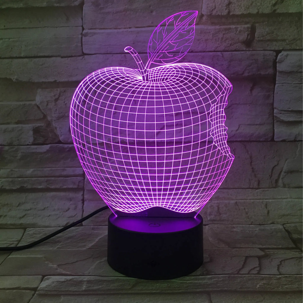 3D fruit-shaped night light with colourful LED glow on a tabletop.