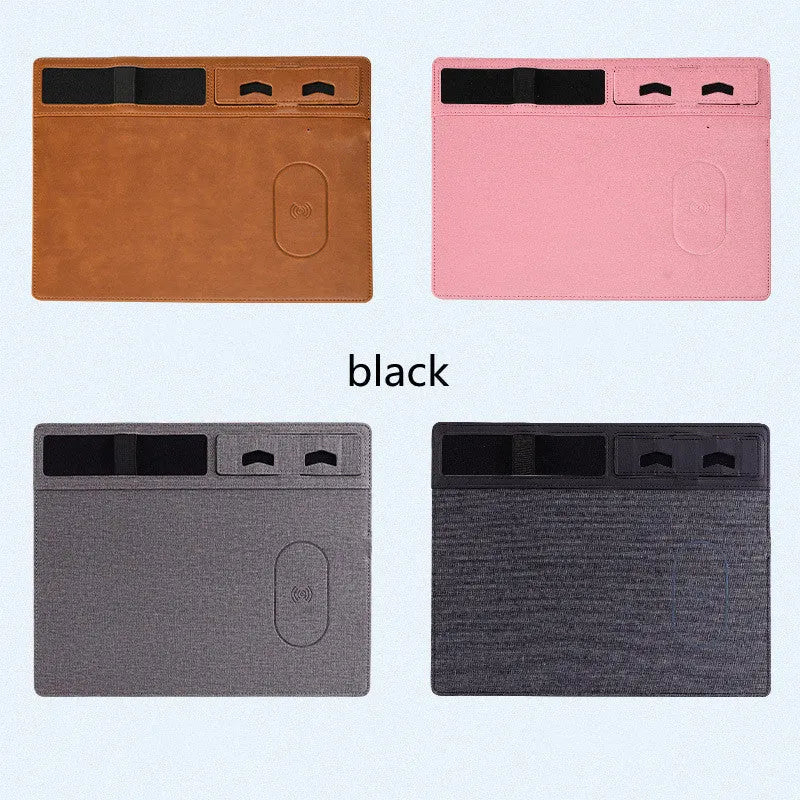 Pink wireless charging mouse pad with integrated phone holder on a desk, showing 320 x 260 mm size.