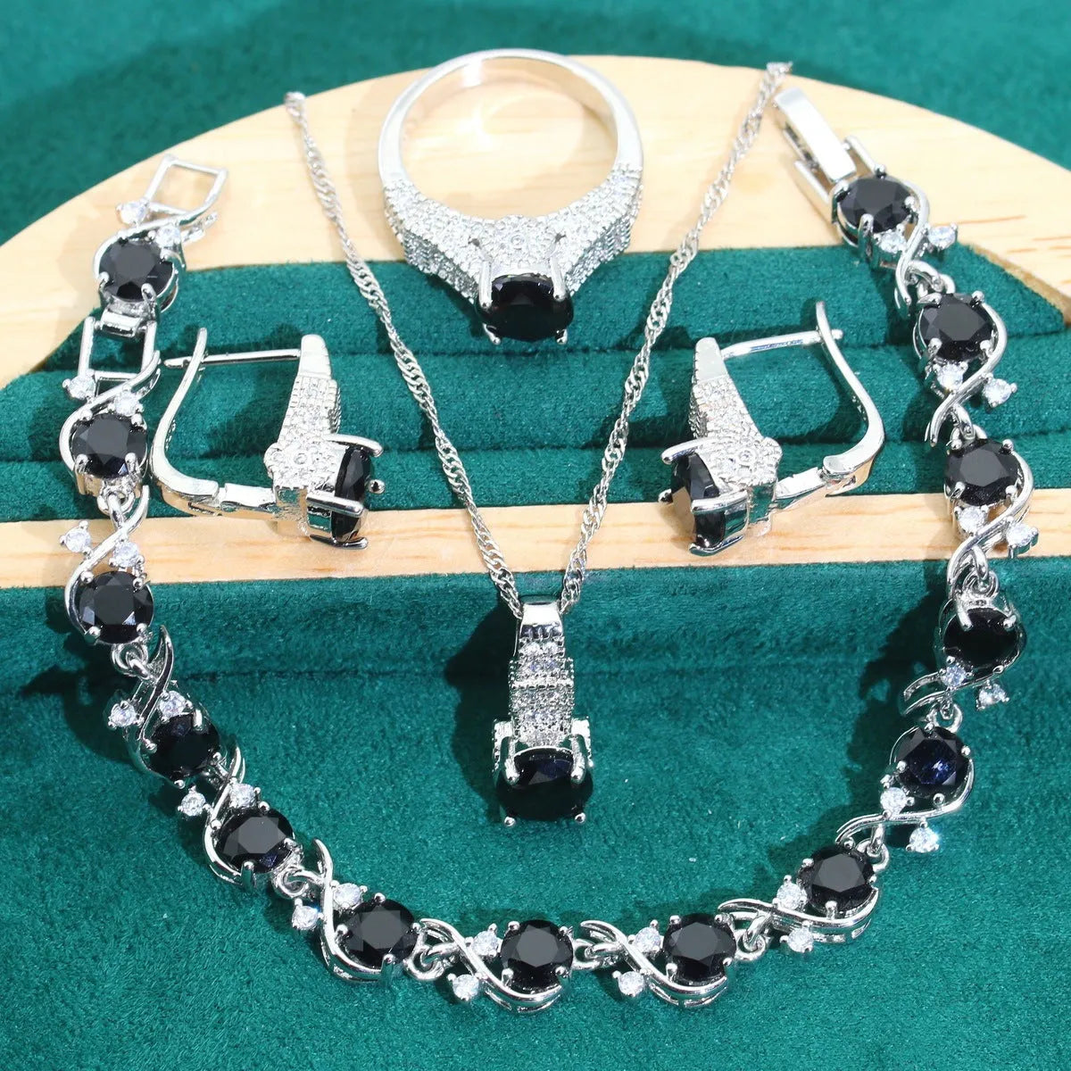 Bridal zircon necklace, earrings, ring, and bracelet four-piece jewellery set in alloy.