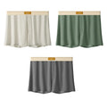 Pack of three men's solid colour loose fit ice silk underwear briefs on a grey background.