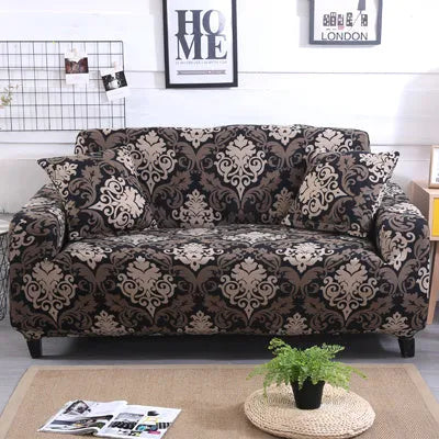 Geometric abstract printed stretch sofa slipcover covering a three-seater sofa with matching cushion covers.