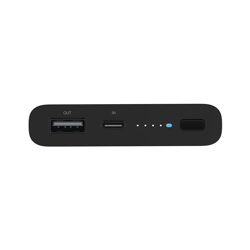 White 10000mAh power bank with USB port and wireless charging surface