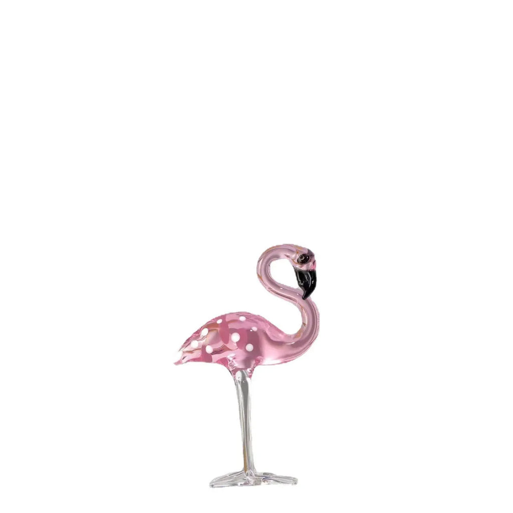 Pink crystal flamingo decorative sculpture on table with modern minimalist design