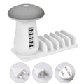 White mushroom-shaped LED desk lamp with a 5-port USB charging dock station at its base on a wooden table