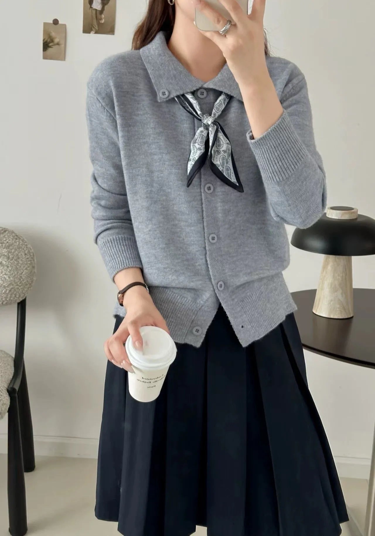 Beige lapel scarf collar acrylic cardigan with long sleeves on a hanger