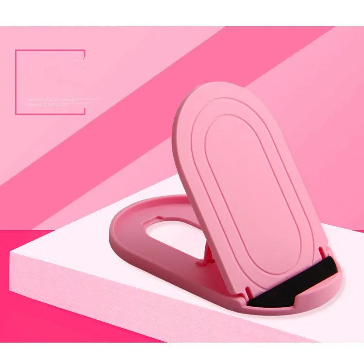 Plastic mobile phone stand with adjustable bracket in six colour options on a wooden desk