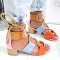 Women's beige suede sandals with thick mid-heel, front strap, and ankle strap on a plain background.