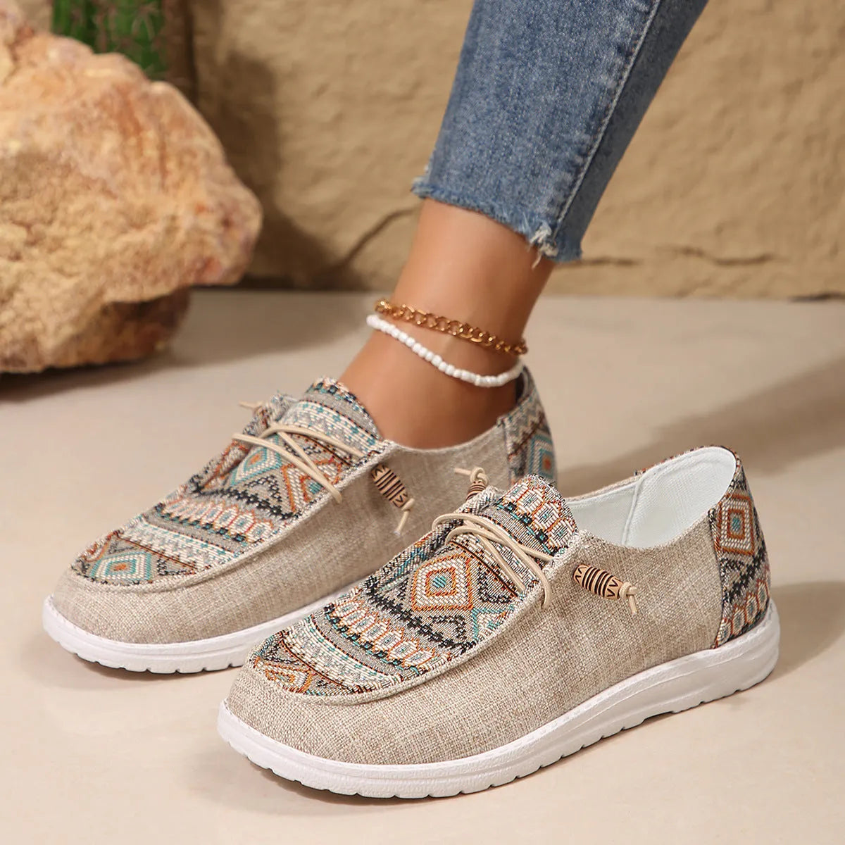 Women's low-top flat slip-on shoes in black with a round toe and rubber sole.