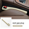 A flexible polyurethane car seat gap filler strip in black, placed between a car seat and centre console.