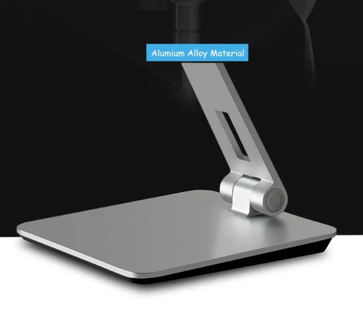 Silver foldable aluminium stand holding a tablet at an angle on a desk