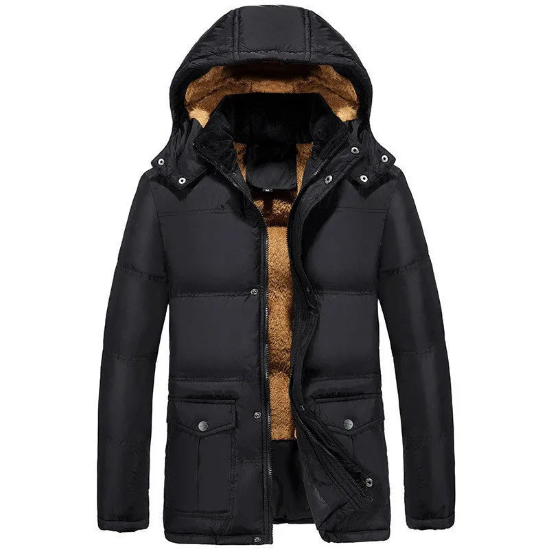 Man wearing a black double-breasted velvet padded hooded winter jacket.