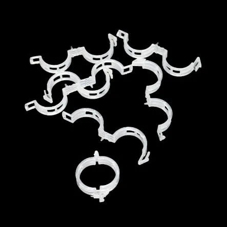 Set of 50 plastic plant grafting clips for tomato and flower stem support.