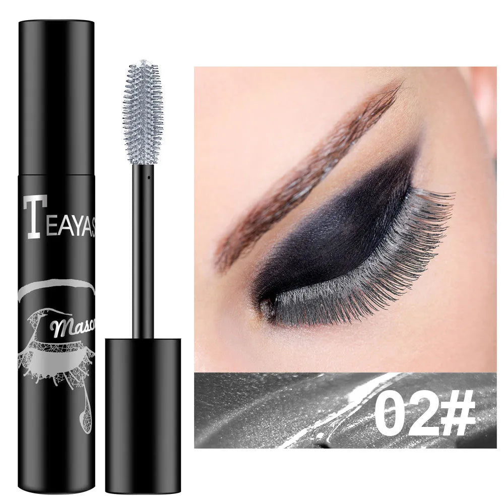 Color fluorescent mascara in seven shades: black, blue, brown, gold, green, purple, and silver