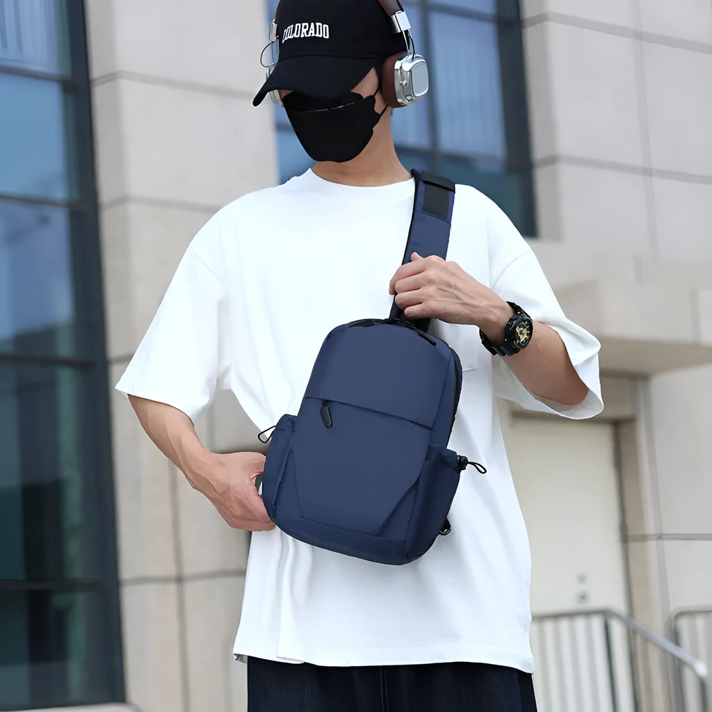 Men's grey lightweight chest bag showing front compartment and adjustable shoulder strap.