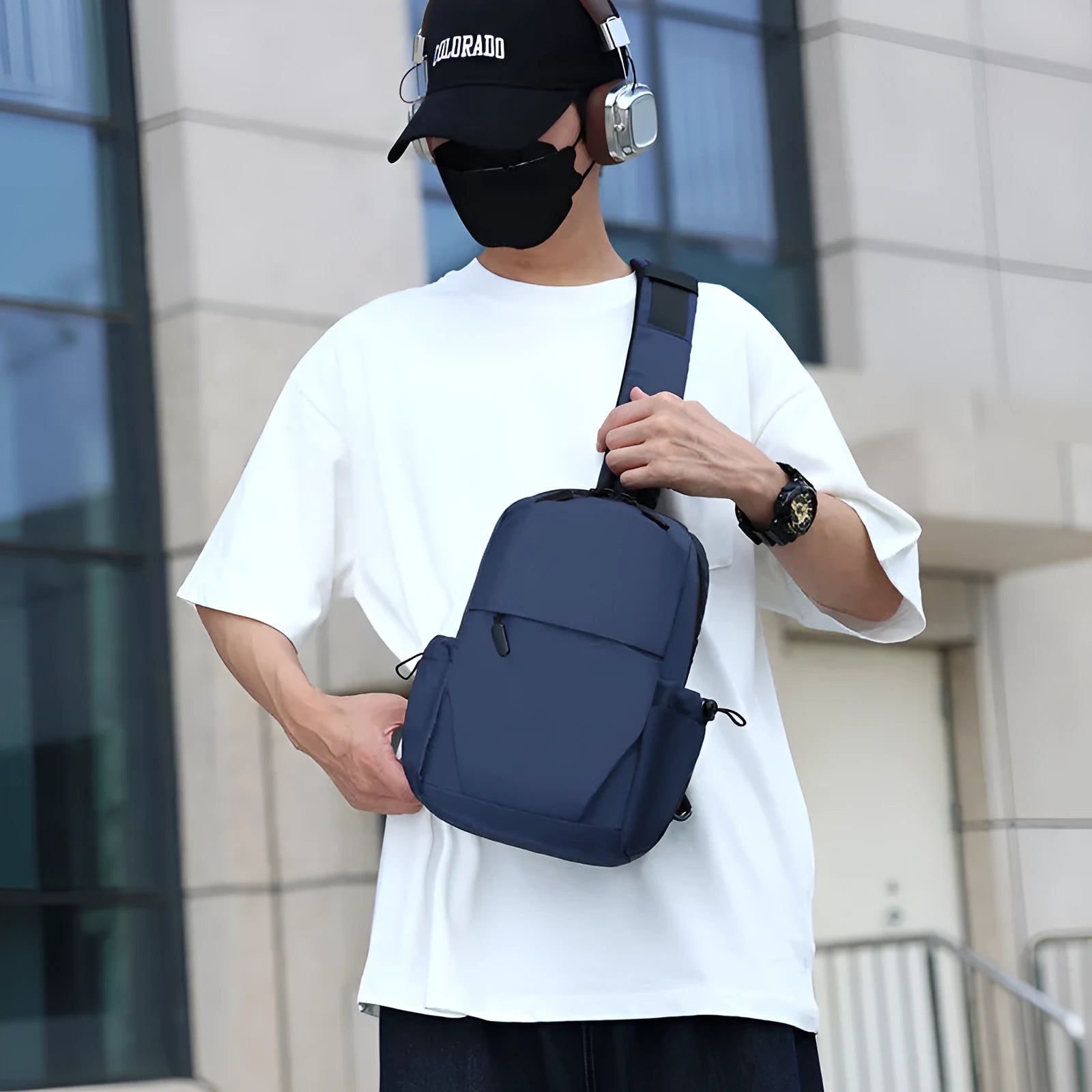 Men's grey lightweight chest bag showing front compartment and adjustable shoulder strap.