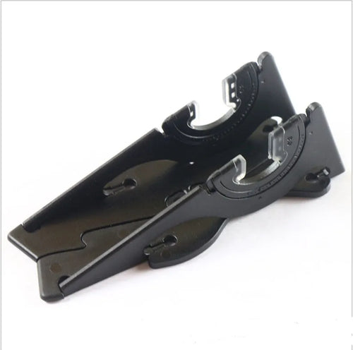 Black plastic card-type mobile phone holder on a wooden desk