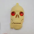 Halloween skeleton skull design USB flash drive with a small metal attachment chain.