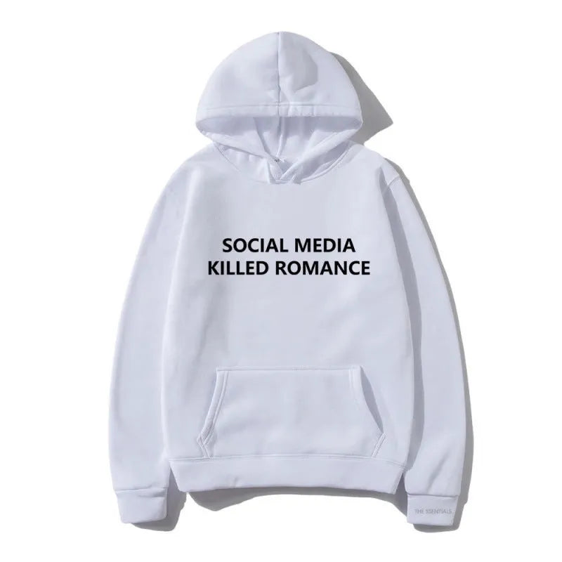 Man wearing a slim fit grey hoodie with a printed white spring letter pattern on the front.