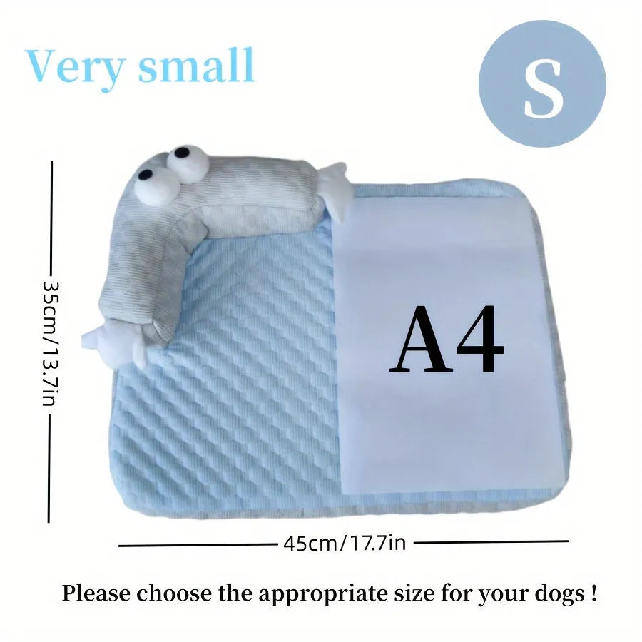 Blue pet bed cushion with cartoon monster face, showing non-slip base and folded size.