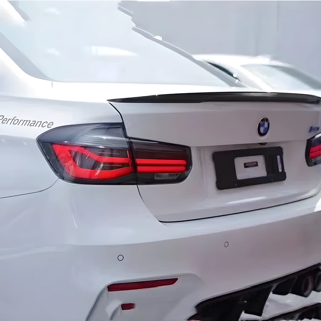 Modified LED tail light assembly for 2012-2015 BMW 3 Series in smoked black housing