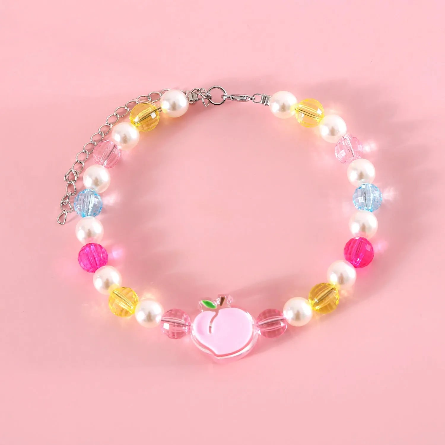 Colourful plastic bead pet necklace in peach, rainbow, or small flower patterns with adjustable sizing.