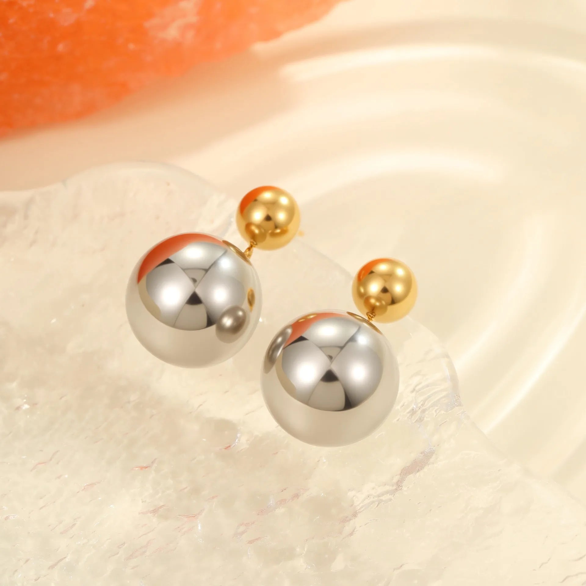 Women's geometric sphere ear studs with stainless steel construction and 18K gold electroplated colour-block finish