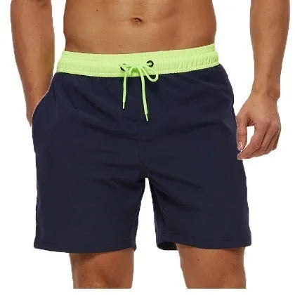 Men's blue running shorts with stitching waistband, zipper pocket, and drawstring for fitness activities