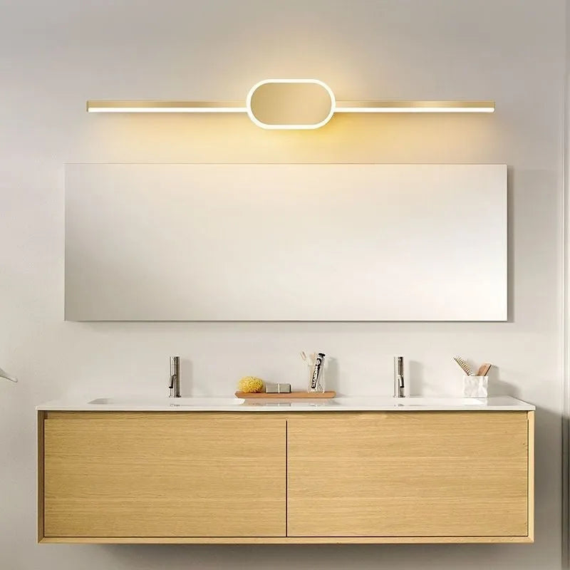 Modern wall-mounted bathroom mirror cabinet with integrated LED makeup lights around the edge.