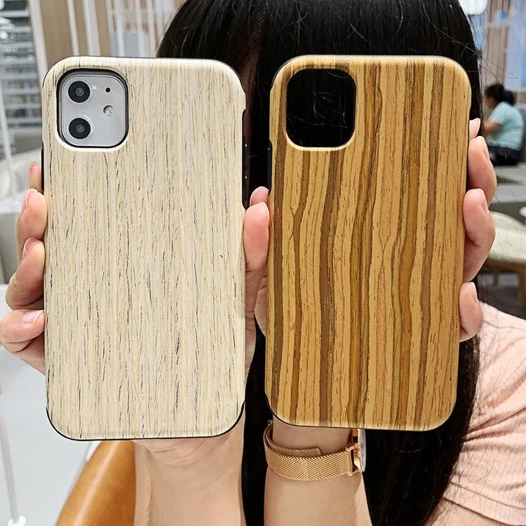 Natural wood grain iPhone back cover case in rosewood finish next to an iPhone