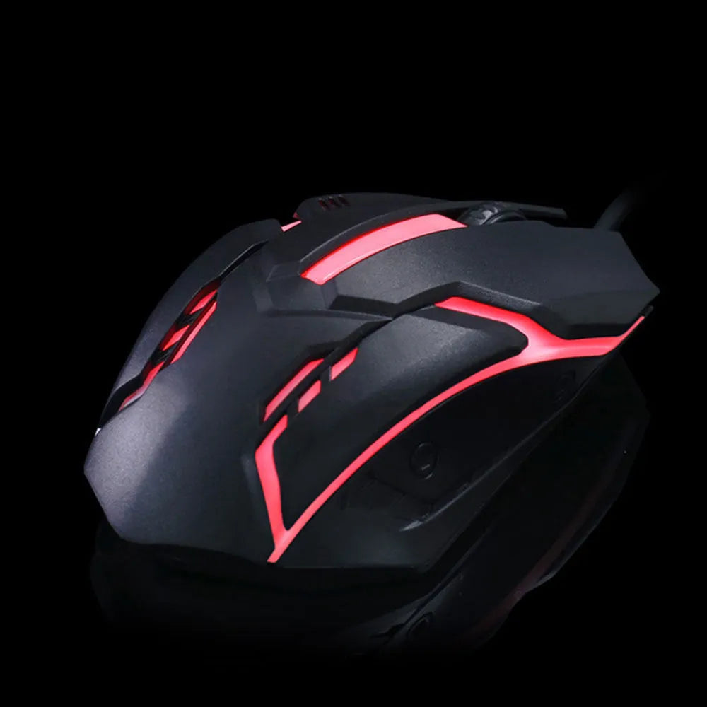 Wired black and white luminous computer mouse with USB cable on desktop