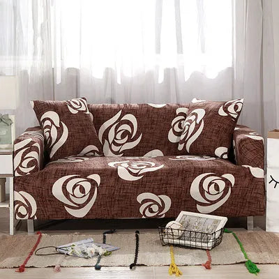 Geometric abstract printed stretch sofa slipcover covering a three-seater sofa with matching cushion covers.