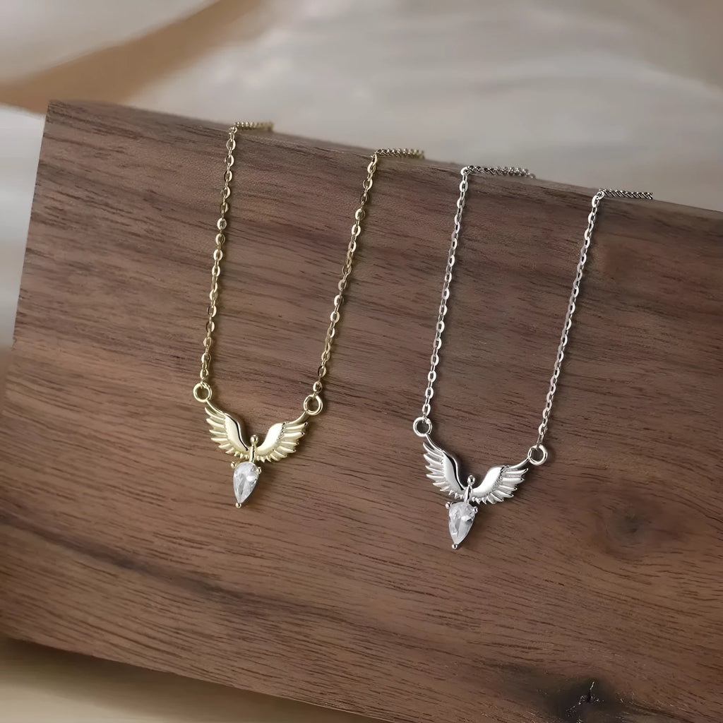 Close-up of an eagle pendant on a silver O-ring chain necklace, showing adjustable length.