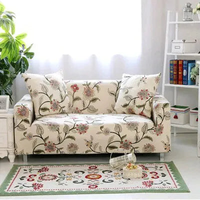 Geometric abstract printed stretch sofa slipcover covering a three-seater sofa with matching cushion covers.