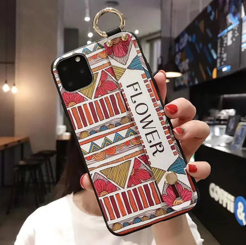 Rose floral patterned phone case with a wrist strap attachment point for iPhone.