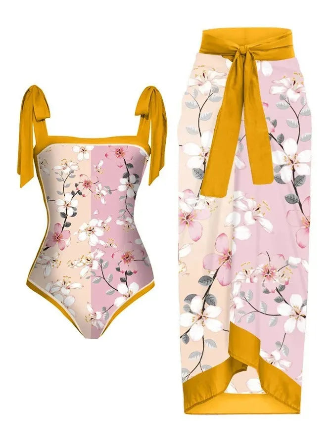 Women's printed chiffon two-piece swimsuit set with a separate hip skirt.