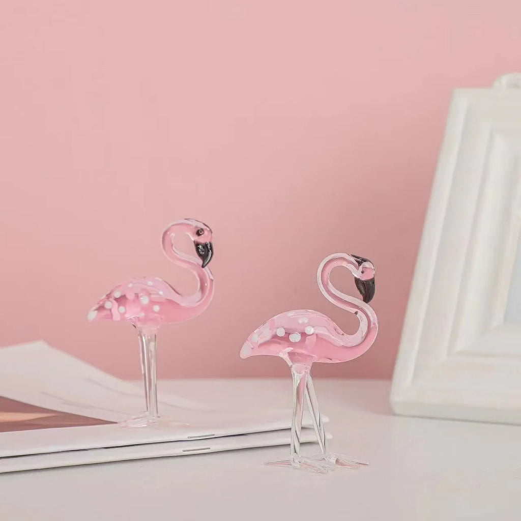 Pink crystal flamingo decorative sculpture on table with modern minimalist design