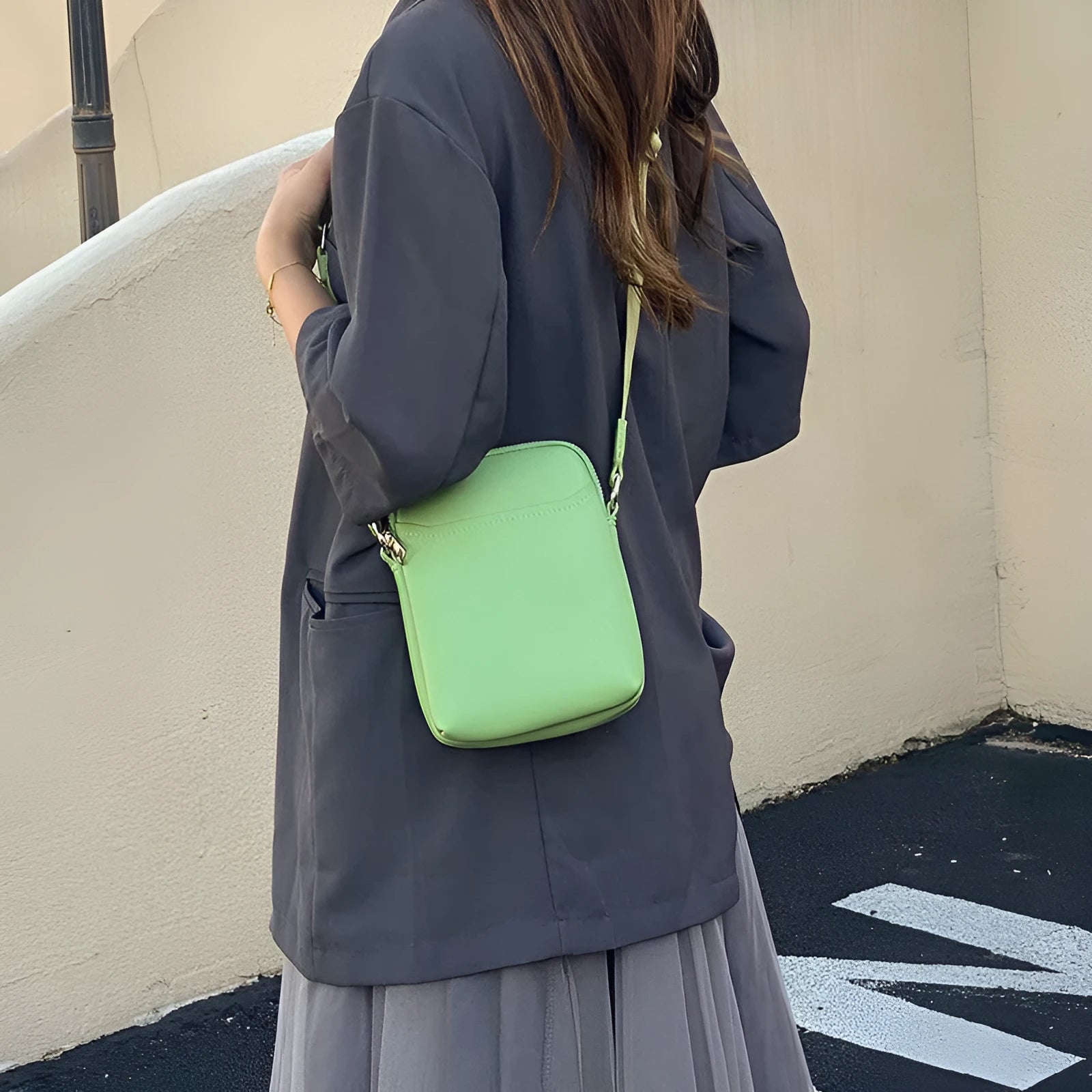 Solid colour PU leather crossbody phone bag for women shown in beige.