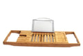 Bamboo bathtub frame storage organiser on bathroom surface holding bathing essentials