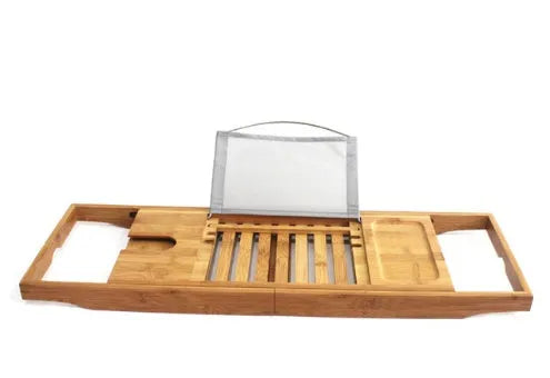 Bamboo bathtub frame storage organiser on bathroom surface holding bathing essentials