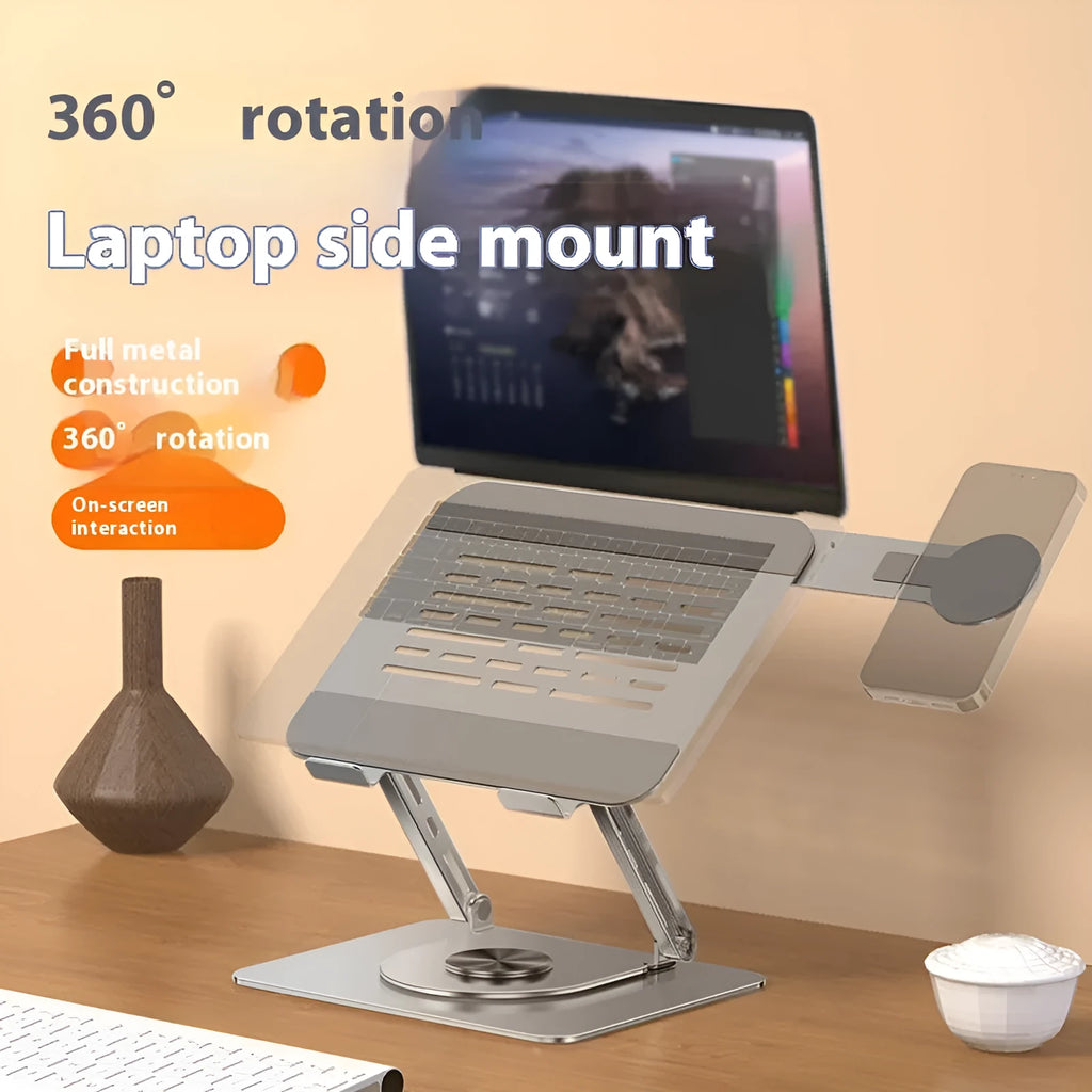 Silver carbon steel laptop stand on a desk, shown rotated with a phone attached to its magnetic holder.